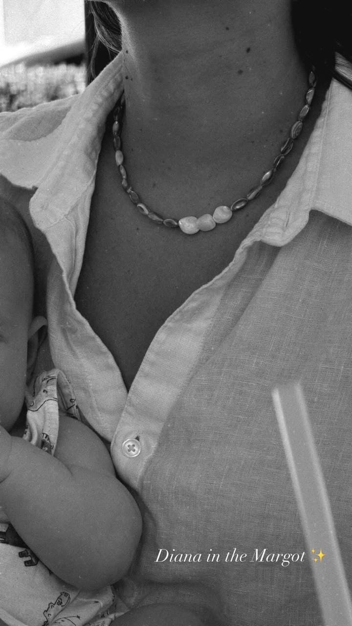 The Margot necklace worn with an open linen shirt