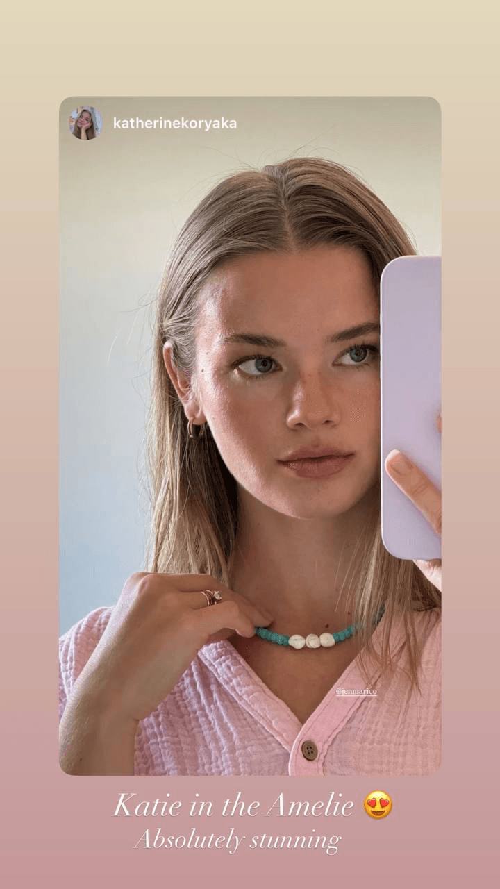 The Amelie necklace with turquoise and shell-pearl beads worn with a pink top